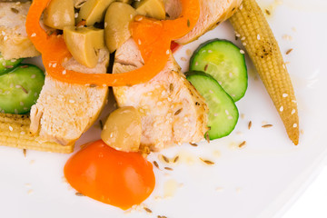 Warm meat salad with vegetables.