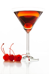 Manhattan cocktail garnished with a cherry