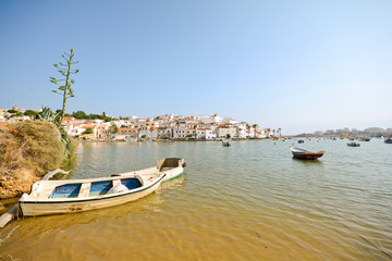 Fototapeta na wymiar View to the fishing village of Ferragudo, Algarve Portugal