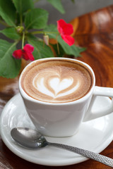 Cup of coffee latte on wooden