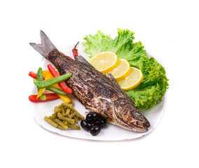 Grilled seabass on plate.