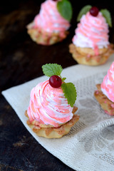 Tartlet with whipped pink cream and berry