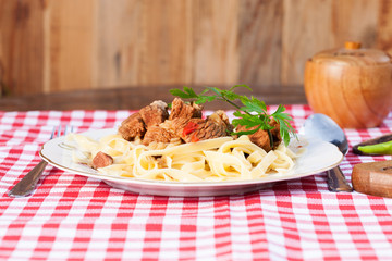 Stew of beef with noodles