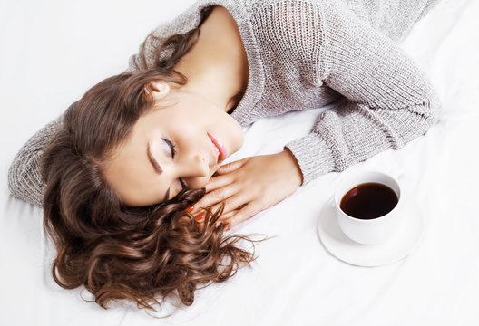 woman in bed with coffee
