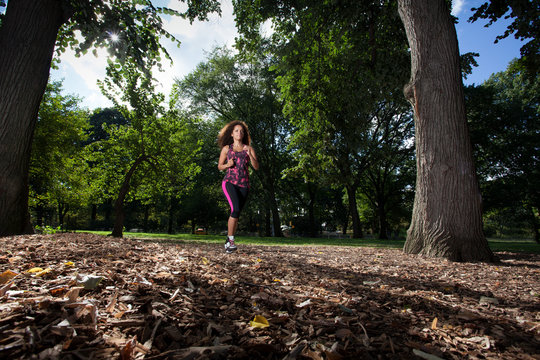 Young Brunette Hispanic woman working out in Central Park