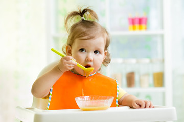 child eating healthy food on kitchen