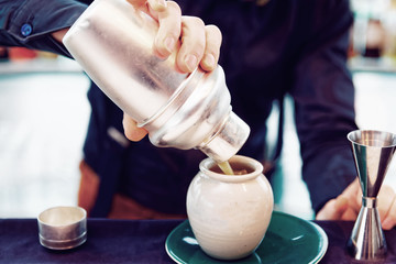 Bartender is making cocktail