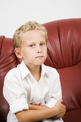 Fototapeta premium young blond boy on sofa