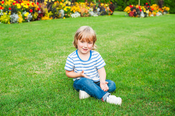 Outdoor portrait of adorable toddler boy