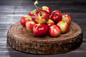 Red apples on wooden background