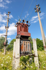 Power transformer against the blue sky background