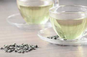 green tea with leaves on the table