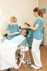 Fototapeta premium Man at the dentist on dental check
