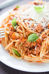 Spaghetti bolognese with parmesan and basil