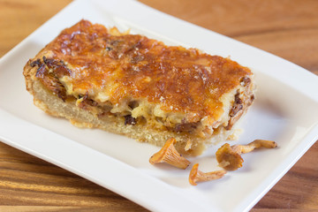 Pie with chanterelles mushrooms, parmesan cheese
