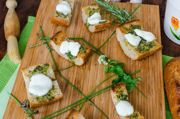 Toast with mozzarella, olive oil, herbs and garlic