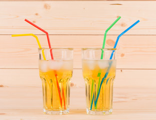 Apple juice on wooden table.