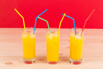 Orange juice on wooden table.