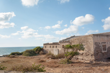 Fototapeta na wymiar Abandoned building on Atlantic coast of Morocco near Dar Bouazza