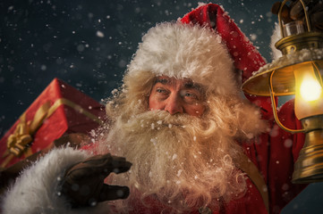 Santa Claus holding sack with gifts