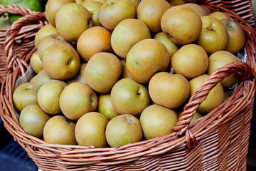 Basket with pears at the market