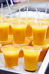 Orange juice on ice at the market