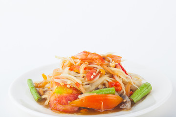papaya salad on dish with white paper background