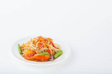 papaya salad on dish with white paper background