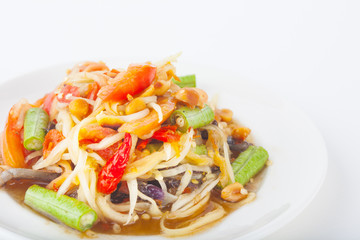 papaya salad on dish with white paper background