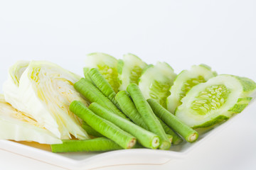 Vegetable side dishes on white paper background