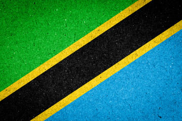 Tanzania flag on paper background - obrazy, fototapety, plakaty