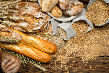 Whole wheat bread on old wooden table