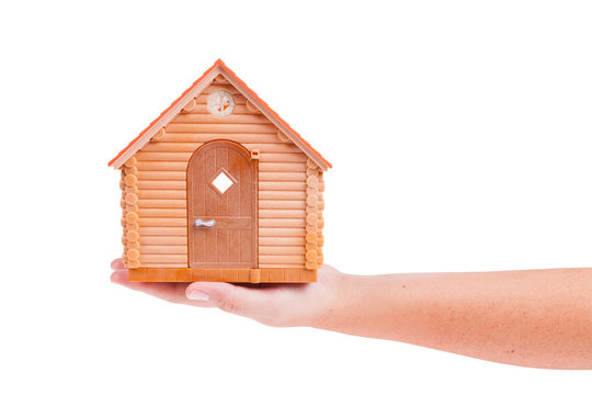 House model in the hand isolated on white background