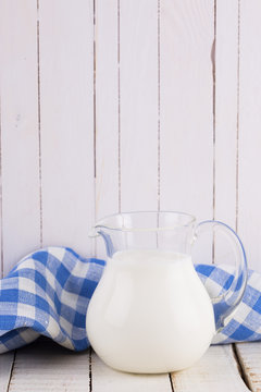 Milk or kefir  on wooden table