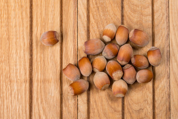 Whole nuts hazelnut on wooden background