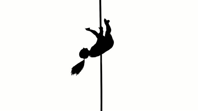 Silhouette of a sexy female pole dancing