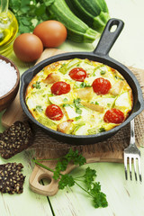 Zucchini baked with chicken, cherry tomatoes and herbs