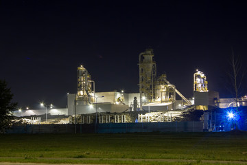 Fototapeta na wymiar Night image of timber processing plant.