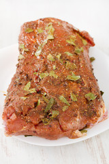 raw pork with pepper on white dish