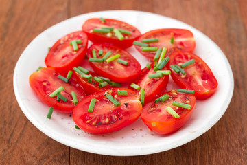 tomato salad in white plate