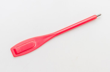Red plastic pencil for write score card.
