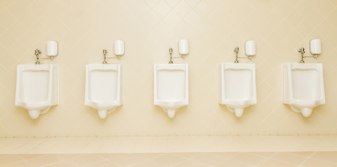 urinal man five clean toilets in public toilets.