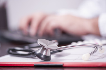 Male Doctor Filling The Medical Form