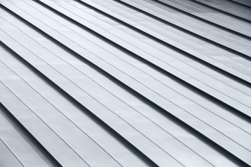 Diagonal corrugated metal gray rooftop surface