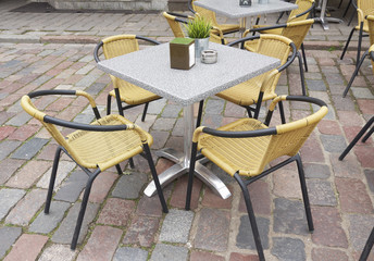 Table and chairs in cafe  on street
