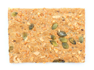 Pumpkin and sesame cracker biscuits isolated over white backgrou