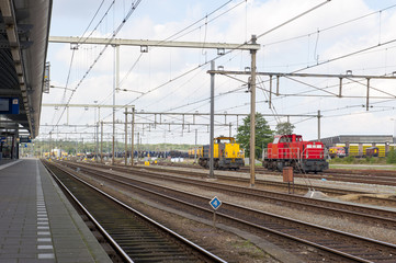 Obraz premium Abandoned train station with industrial locomotives
