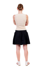 back view of standing young beautiful  woman.