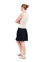 back view of walking  woman in dress. beautiful blonde girl in m