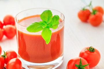 Fresh tomato juice wooden background